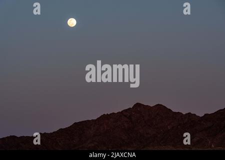 A bright full moon in Yuma, Arizona Stock Photo