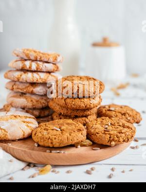 cereal cookies on wooden board with sunflower seeds on the table Stock Photo
