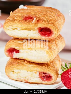 Sweet puff pastry with cottage cheese and strawberries Stock Photo