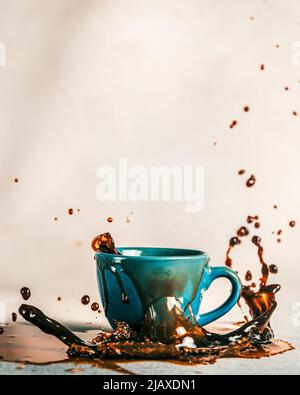 coffee splash on white table Stock Photo