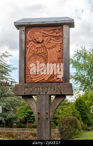 Village of Compton, Surrey, England, UK, in spring with red white and ...