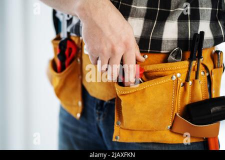 Tool kit in repairman's mounting belt Stock Photo