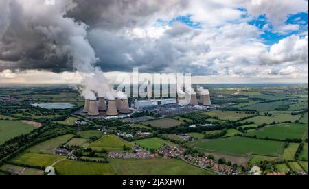 An aerial landscape view of Drax coal fired Power Station in North Yorkshire emitting carbon dioxide pollution into the air and burning biofuel Stock Photo