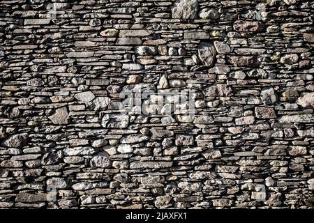 Full frame resources background of a tall and wide dry stone wall typical to Yorkshire, Lancashire and Cumbria in the UK with copy space Stock Photo