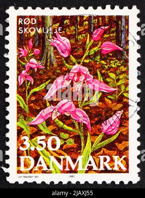 DENMARK - CIRCA 1990: a stamp printed in the Denmark shows Red Helleborine, Endangered Plant Species, circa 1990 Stock Photo