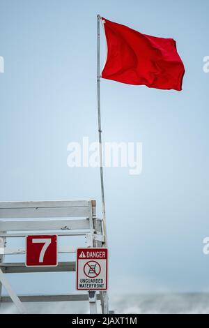 Stock photos of tropical storm Henri in 2021, Newport, RI. Stock photos of hurricane. Stock photos of extreme weather. Empty life guard chair. Stock Photo