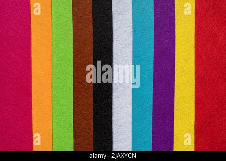 Felt strips of various colors simulating the rainbow. School supplies for crafts Stock Photo