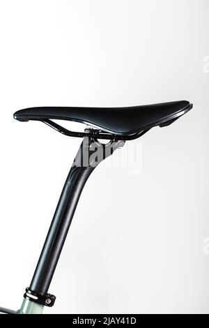 Bicycle saddle with seatpost on a light background accessories for bike repair and tuning Stock Photo
