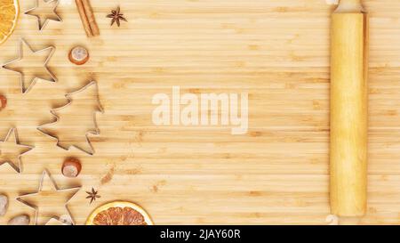 Cookie cutters with dried fruits, nuts and spices on a wooden board Stock Photo