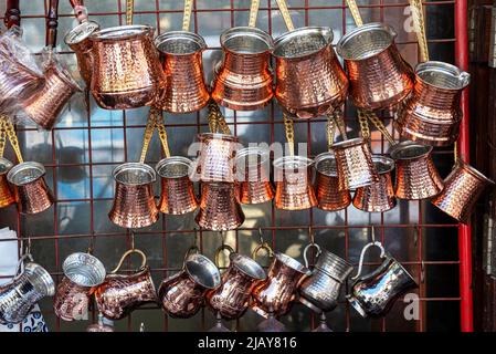 Antique Turkish coffee pots which made of copper on an outdoor souk in the city of Gaziantep Stock Photo