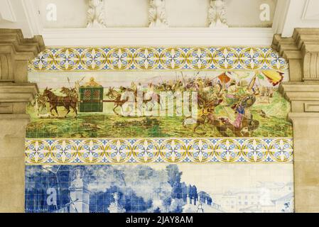 Decorative ceramic tiles azulejos surround the interior of the entrance hall of the railway station in Porto Stock Photo