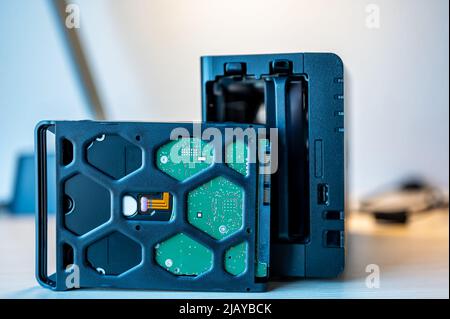 network attached storage NAS with a single bay pulled setup at a home office and remote work redundancy Stock Photo