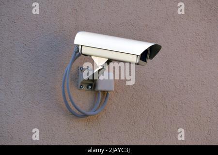 CCTV - security camera on a wall Stock Photo