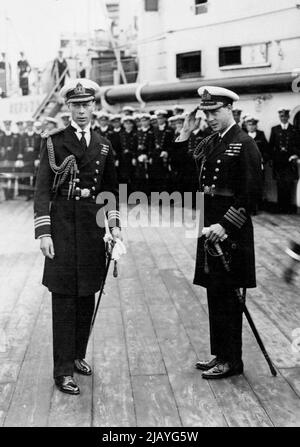 The Prince of Wales' Home Again: The Prince with his brother, the Duke of York on board H.M.S. 'Renown' on arrival at Plymouth. The Prince of Wales arrived back in London on June 22nd after his eight months tour in India, Japan, etc. January 7, 1935. (Photo by Central News). Stock Photo