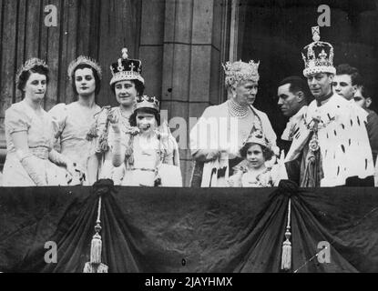 The coronation of King George VI. And Queen Elizabeth. Scenes After The Ceremony . A happy picture on the balcony of balcony of Buckingham Palace, showing H.M. The King N.M. The Queen, Queen Mary, and the two princesses. Queen Marry's family after the Coronation of George VI and Queen Elizabeth. Waving is the young Princess now Queen Elizabeth II. From this balcony of Buckingham Palace, the old Queen has seen events shape themselves and then pass into history - while she lives on. May 12, 1957. (Photo by Sport & General Press Association Limited). Stock Photo
