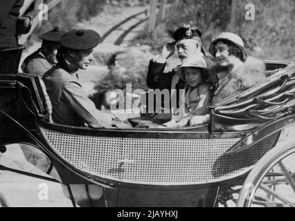 King Attends Divine Service At Crathie Church -- H.M. the King and the Duke and Duchess of York, with Princess Elizabeth, driving from Crathie Church after the service. H.M. the King, who is at present spending his annual holiday at Balmoral Castle, Aberdeenshire, Scotland, yesterday attended Divine Service at Crathie Church, which is close by the famous castle. August 27, 1934. (Photo by Topical Press) Stock Photo