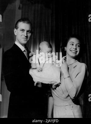 T.R.H. Princess Elizabeth And The Duke of Edinburgh With Prince Charles. Taken by Royal Command, photograph shows Princess Elizabeth and the Duke of Edinburgh with Prince Charles at Buckingham Palace. This is the first picture of the family together. May 5, 1949. (Photo by Baron, Baron Photo Centre Ltd.). Stock Photo