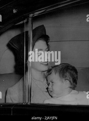 Royal Family Back In London : Princess Elizabeth carries her baby Prince Charles as the drives from Euston Station, London on her return form Scotland this morning October 10. She and other members of the Royal Family have been spending a holiday at Balmoral Castle. October 17, 1949. (Photo by Associated Press Photo). Stock Photo