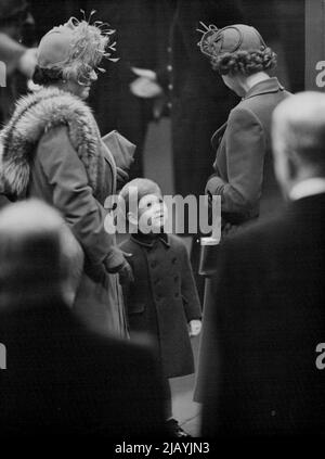 His Big Moment : Prince Charles went to London's Euston Station to meet his parents today, November 17, on their return from Canada. Here he turns his face up to chat with his mother, Princess Elizabeth, at left is the Queen, his grandmother. February 13, 1952. (Photo by Associated Press Photo). Stock Photo