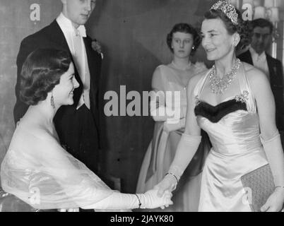 Duchess Attends Snow Ball -- Patricia Barry curtsies to the Duchess of Gloucester. The Duchess of Gloucester attended the Snow Ball in aid of the United Appeal for the Blind and the British Empire Society for the Blind, which was held at the Dorchester Hotel, London, last night. December 16, 1954. (Photo by Evening Standard Picture) Stock Photo