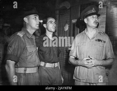 Duke of Gloucester visits convalescent Depot at Lae, where front-line soldiers recuperate. Accompanied by Lt. G. G. Laws (Victoria) and Sergt. Roy Ryan (Brisbane), the Duke inspects the display of work. July 16, 1945. Stock Photo