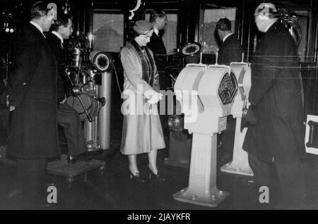 Duke And Duchess Of Gloucester Open Ideal Home Exhibition -- The Duke and Duchess of Gloucester on the bridge of the Queen Mary Model at the Exhibition. The Duke and Duchess of Gloucester opened the Ideal Home Exhibition at Olympia (London) this morning. March 30, 1937. (Photo by London News Agency & Photos Ltd.). Stock Photo