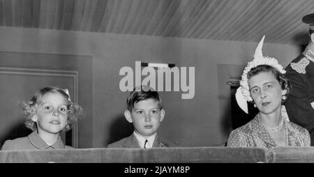 The Duchess At Royal Tournament -- Duchess of Kent, wearing an attractive feathred cloche, with her son, Prince Michael of Kent, and a friend, when they attended a performance of the Royal tournament at Earl's Court here. June 21, 1950. Stock Photo