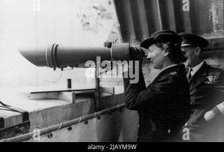 The Duchess Of Kent Takes A Look At Liberated France -- The Duchess of Kent looking through binooulars at the liberated French coastal towns, from Dover Castle. These binooulars were actually taken from the Italian battleship 'Littorio” after the surrender of the Italian Fleet at Malta. They wore originally fixed for Hitler to review the Italian Fleet during a visit to Spezia. The Duchess of Kent made a tour of naval establishments at Dover where members of the W.R.N.S. have been serving in various capacities almost continuously throughout the air raids, bombing and shell-fire which the war br Stock Photo