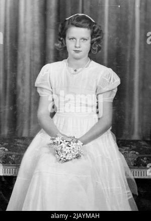 Only Daughter of T.R.H. The Duchess of Kent and the late Duke of Kent, who will be eight years old on Christmas Day. A new portrait of:- H.R.H. Princess Alexandra -- Princess Alexandra, Helen Elizabeth Olga Christabel, is the only daughter of T.R.H. the Duchess of Kent and the late Duke of Kent, and a niece of the King. She was born on the 25th December 1936, and has two brothers, the present young Duke of Kent and Prince Michael. The little Princess is seen in the dress she were as Bridesmaids at the recent wedding of Lt.-Col, and Mrs. H. P. Phillips, Mrs. Phillips was ***** Miss Georgina Wer Stock Photo