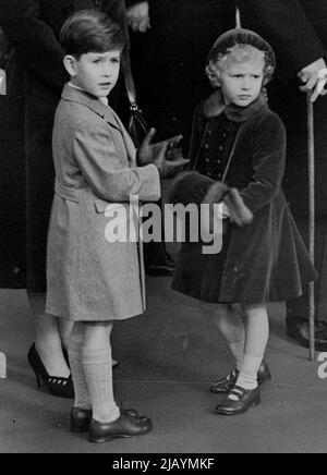 The Queen Mother Arrives Home Again -- The Queen Mother arrived home to-day her tour of America and Canada. The Queen, Duke of Edinburgh, Prince Charles and Princess Anne went to waterloo station to greet her on arrival from Southampton. This picture taken at the station this morning shows the two Royal children awaiting the arrival of their grandmother. November 24, 1954. (Photo by Daily Mail Contract Picture). Stock Photo