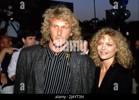 Michelle Pfeiffer with Peter Horton at the Married to the Mob Premiere ...