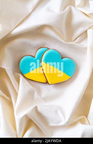 Two gingerbread cookies in ukrainian flag colors Stock Photo