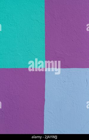 Colorful geometric shapes in shades of blue and purple on a painted wall in Nassau, Bahamas. Stock Photo