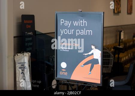 A sign introducing Amazon One is seen at an Amazon Fresh store in Irvine, California, on Sunday, May 8, 2022. Amazon One is a payment system based on ... Stock Photo