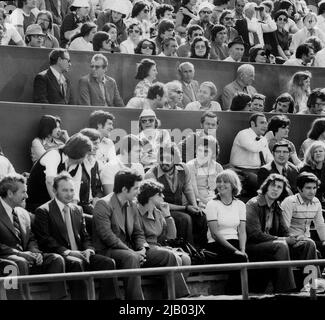 Bucharest, Romania, approx. 1977. Individuals belonging to the communist-era nomenklatura attending an important sports event. In the lower tribune: Serghei Mizil (center, with sunglasses & beard), Jean Maurer (on his right), Dana Maurer (bottom row, smiling). Around them, other children of Government officials and Secret Police officers protecting them.