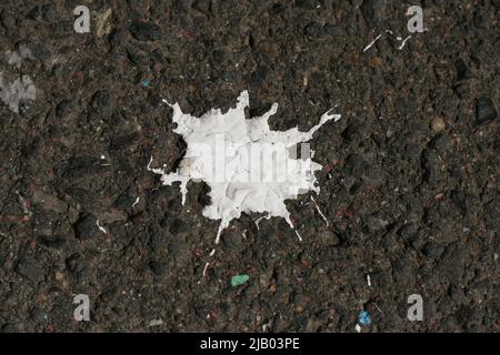 White Paint drops on the ground. Costruction paint. Urban texture backround. Conceptional minimalistic monochrome. Black and white Stock Photo