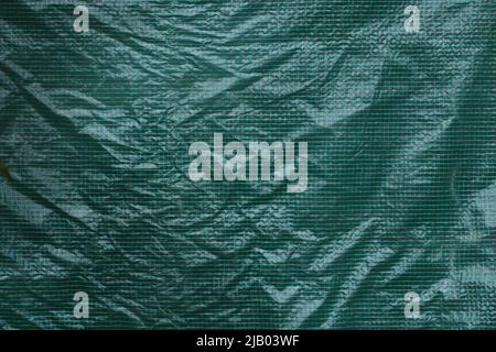Green grid plastic foil film. Greenhous plastic cover. Texture. Background. Front view Stock Photo