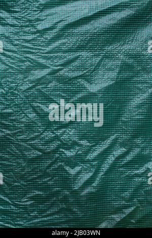 Green grid plastic foil film. Greenhous plastic cover. Texture. Background. Front view Stock Photo