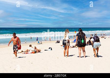 Queensland Australia /  Tourists and locals alike enjoy the sunshine, seaside and beach at Surfers Paradise. Stock Photo