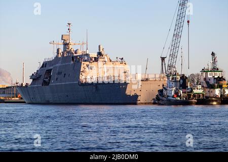 Marinette, Wisconsin, USA, May 7, 2022 - USS Marinette (LCS-25) combat ship on the Menominee River off of Lake Michigan sitting in port., horizontal Stock Photo