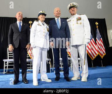United States President Joe Biden, second right, and US Secretary of Homeland Security Alejandro Mayorkas, left, participate in a change of command ceremony with outgoing Commandant Admiral Karl L. Schultz, right, and incoming Commandant Admiral Linda Fagan, second left, at US Coast Guard Headquarters in Washington, DC on Wednesday, June 1, 2022. Credit: Bonnie Cash/Pool via CNP Stock Photo