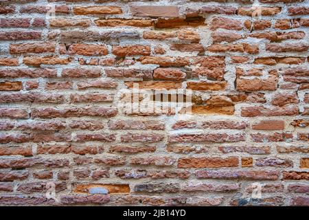 Aged brick wall of Toulouse, France known as the Pink City Stock Photo