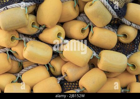 Drying fishing nets with yellow floats. Background photo Stock Photo