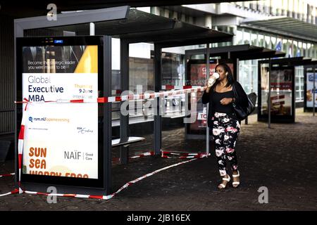 2022-06-02 07:39:56 THE HAGUE - Travelers wait in vain for the tram at The Hague Central Station. Staff of the public transport company HTM in The Hague are on strike for a better collective labor agreement. FNV and CNV demand a wage increase of 5 percent and retention of purchasing power. ANP RAMON VAN FLYMEN netherlands out - belgium out Stock Photo