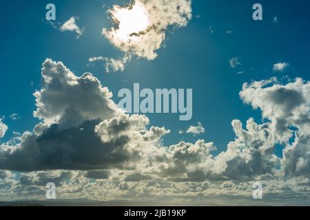 Dark clouds in a blue sky Stock Photo