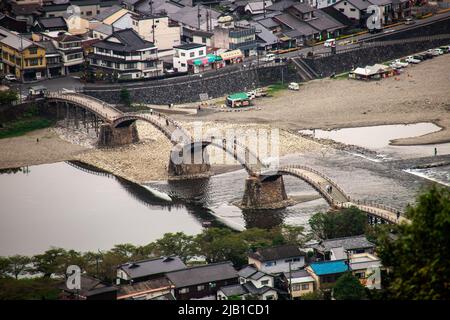 Top view of Kintai Bridge (Kintaikyo), a historical wooden arch bridge in Iwakuni, in cloudy day. It was built in 1673, spanning the Nishiki River Stock Photo