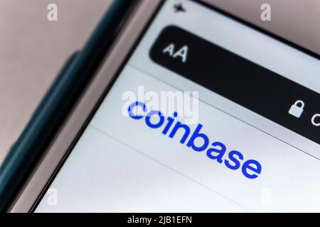 Kumamoto, JAPAN - Apr 22 2021 : Cryptocurrency platform Coinbase logo on iPhone. On 2021, It went public on Nasdaq exchange via a direct listing Stock Photo