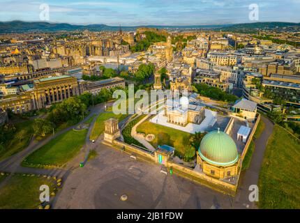Aerial view at sunrise of Calton Hill and skyline of Edinburgh, Scotland, Uk Stock Photo