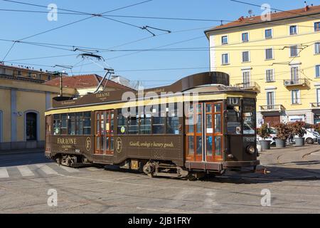 Milan, Italy - March 23, 2022: Old tram Ventotto type Milano public transport transit transportation traffic at Stazione Genova station in Milan, Ital