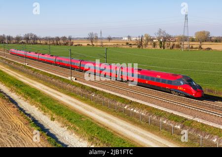 Melegnano, Italy - March 24, 2022: Italo ETR 675 Pendolino high-speed train of Nuovo Trasporto Viaggiatori NTV on the Milan - Bologna high speed rail Stock Photo